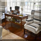 F14. Pair of striped wingback chairs with custom upholstery. 45”h x 30”w x 28”d 